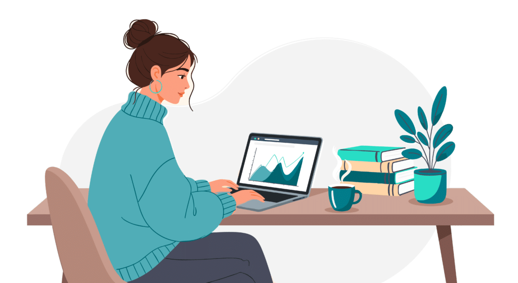 Woman sitting at her desk looking at laptop with bar graphs