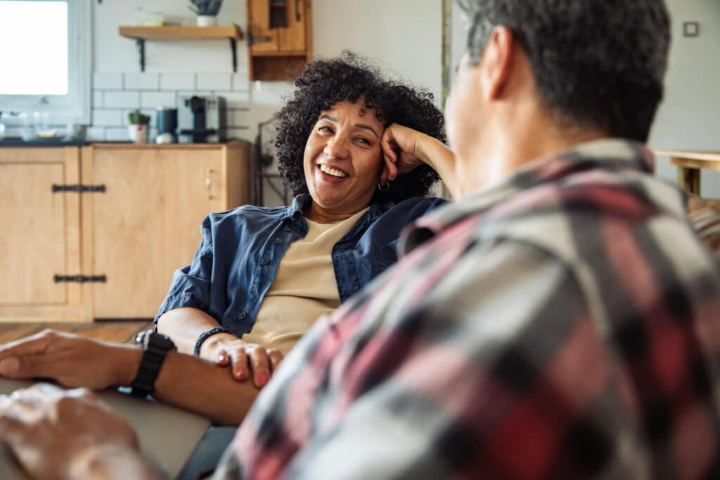 Middle aged couple relaxing at home from everyday stress and anxiety