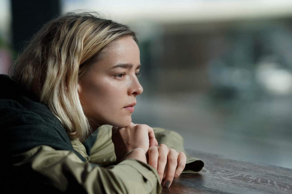 Teen absorbed in thoughts looking out the window