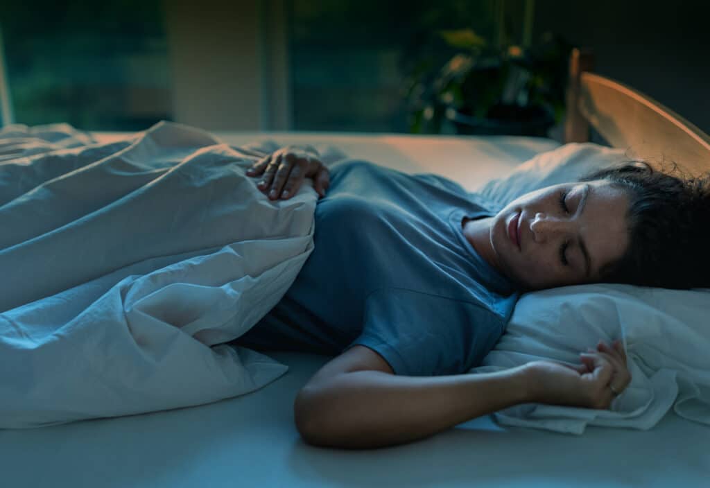 insomnia and anxiety -Woman sleeping in bed at night