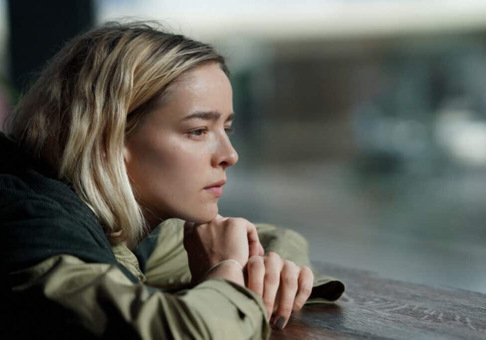 Teen absorbed in thoughts looking out the window