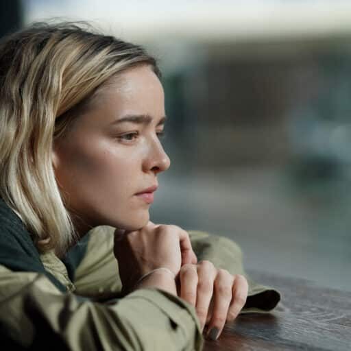 Teen absorbed in thoughts looking out the window