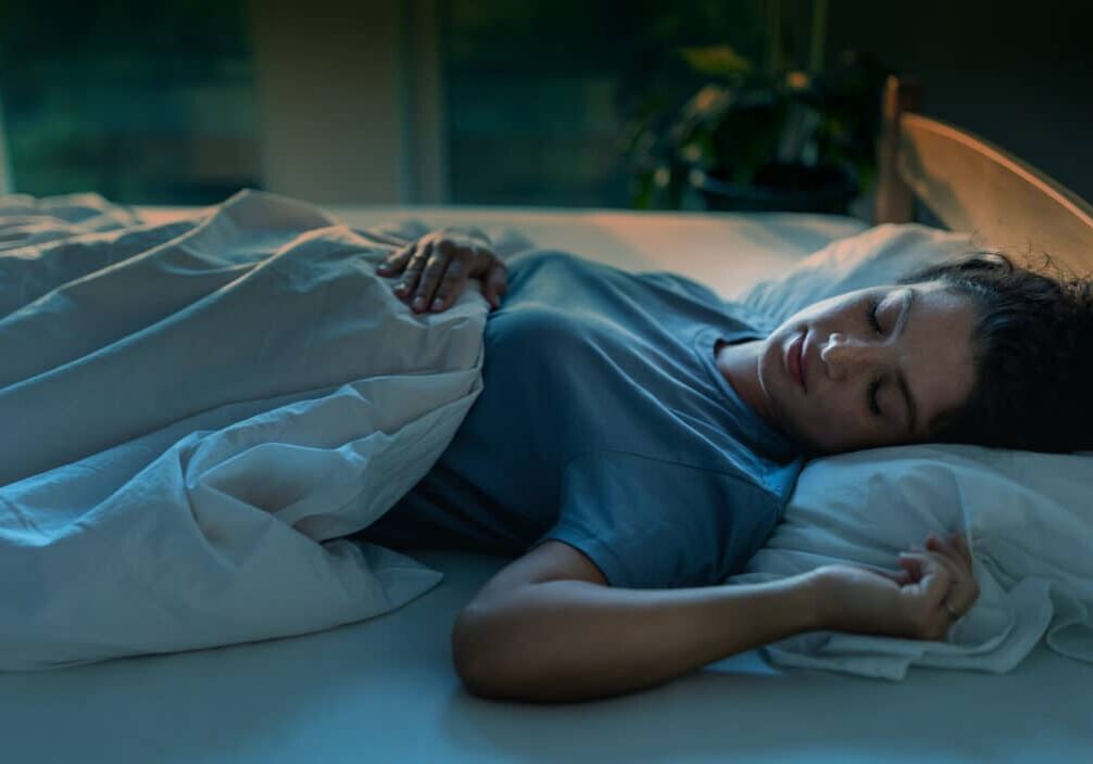 insomnia and anxiety -Woman sleeping in bed at night