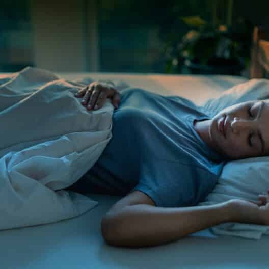 insomnia and anxiety -Woman sleeping in bed at night