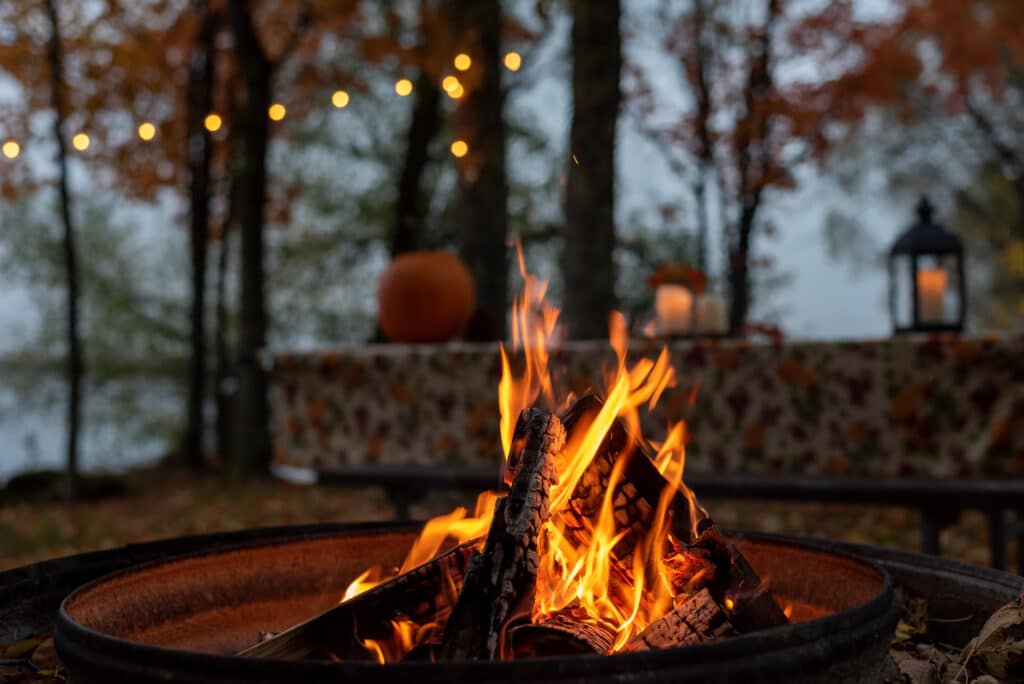 Closeup of glowing outdoor campfire in fall