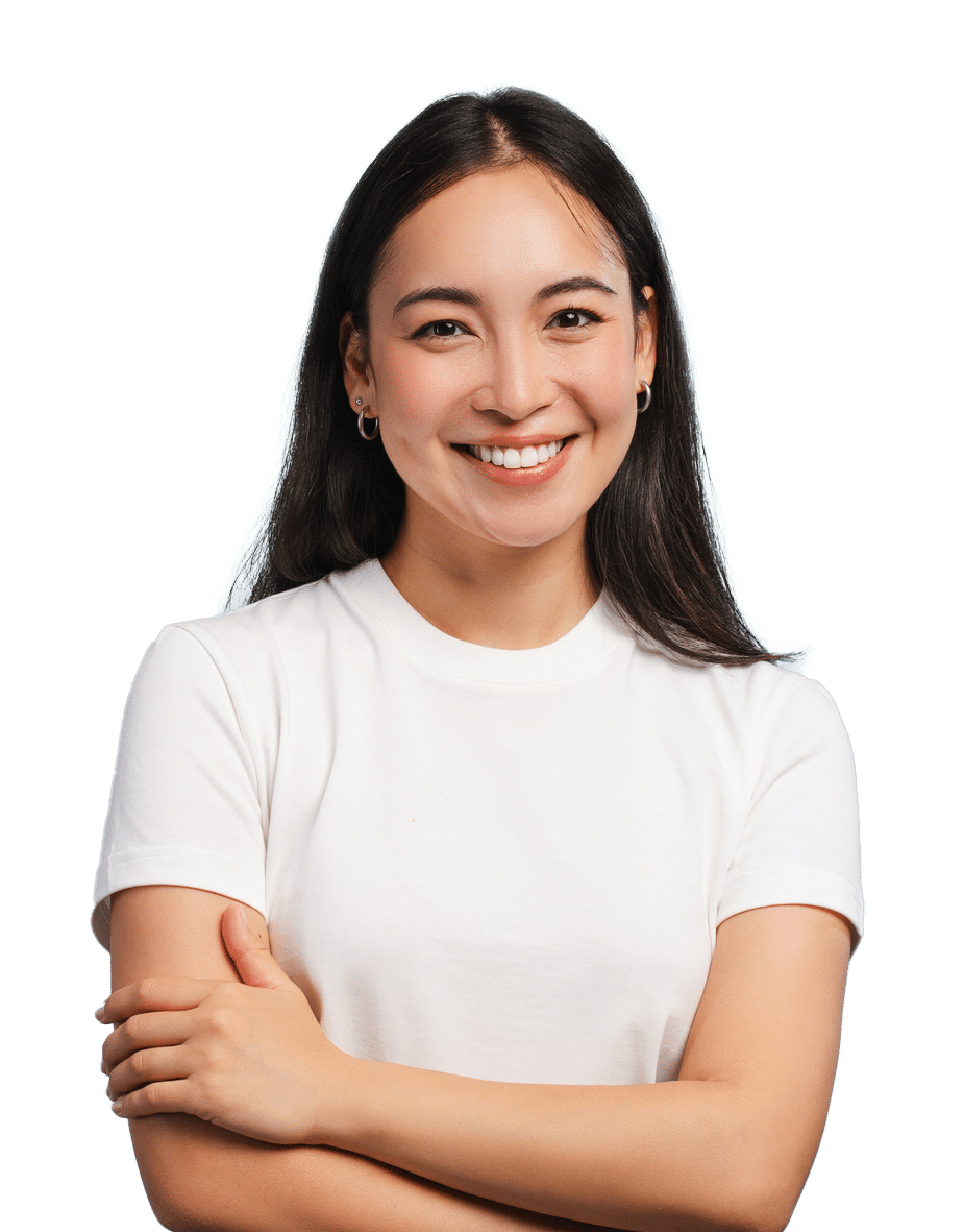 young woman smiling with arms crossed