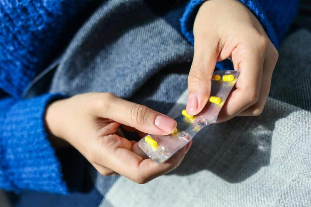 Person Holding Medication Blister Pack